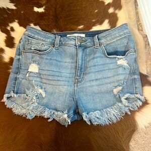 Ripped jeans shorts- stretchy. Size M